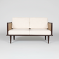 Bruce mid-century modern teakwood two seater sofa with cane side panels and upholstered seat and back cushions – front view