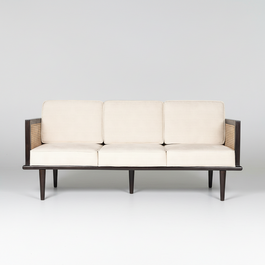 Three-seater sofa with white cushions and wooden frame on a light gray background