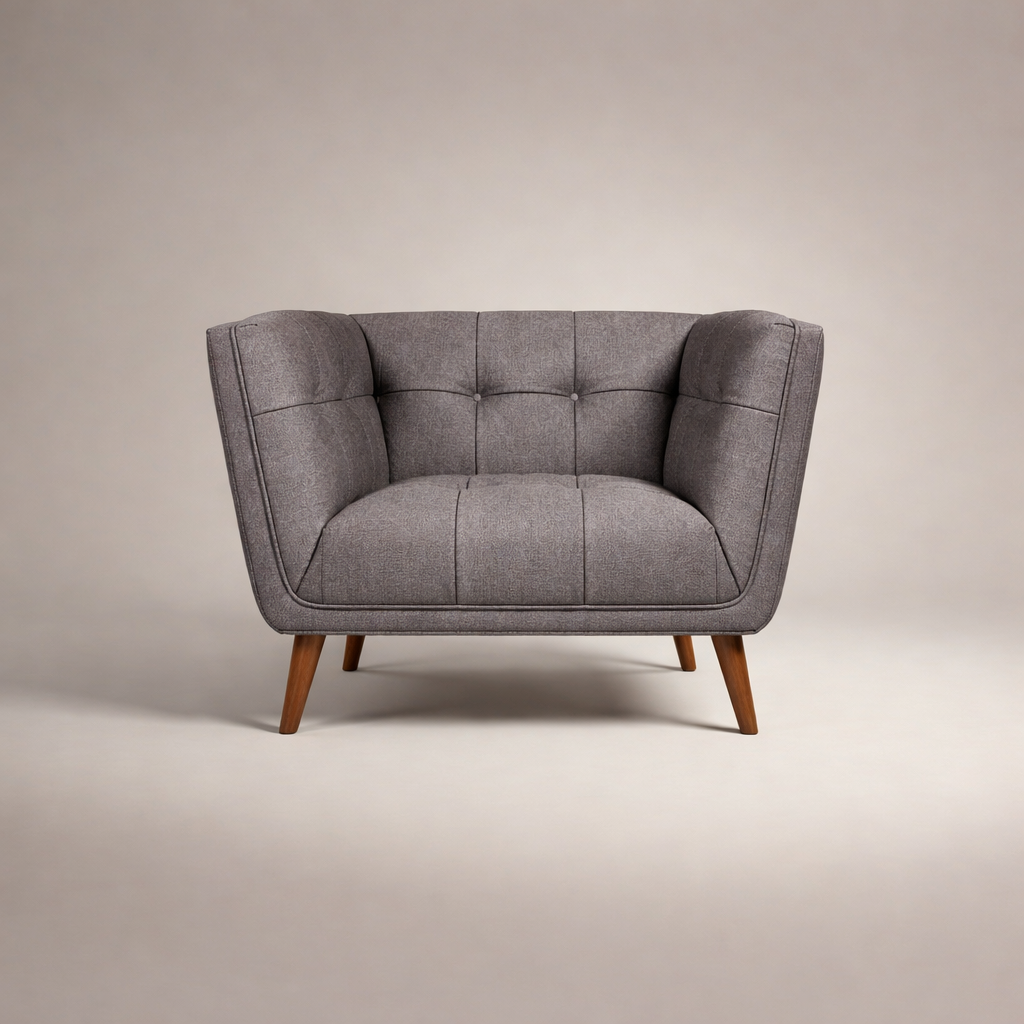 Gray upholstered chair with wooden legs on a beige background