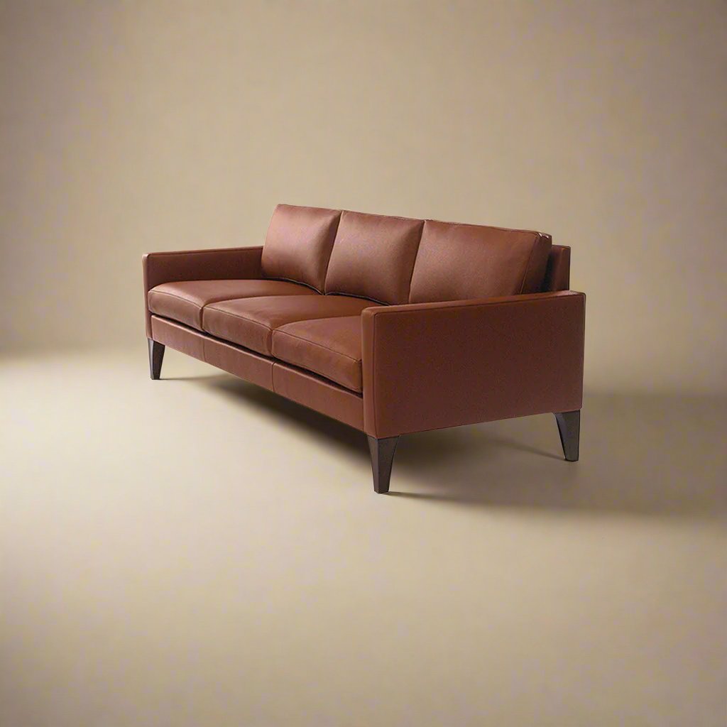 Cyrene W contemporary faux leather three seater sofa with wooden legs in warm tan upholstery isometric view