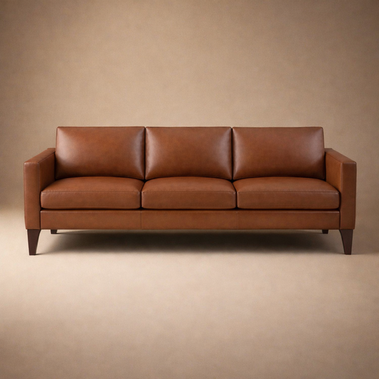 Cyrene W contemporary faux leather three seater sofa with wooden legs in warm tan upholstery front view