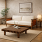 Hibiki Japanese minimalist teakwood sofa with upholstered seat and back cushions and signature side leather panel detail – lifestyle image with Koshi Japanese coffee table