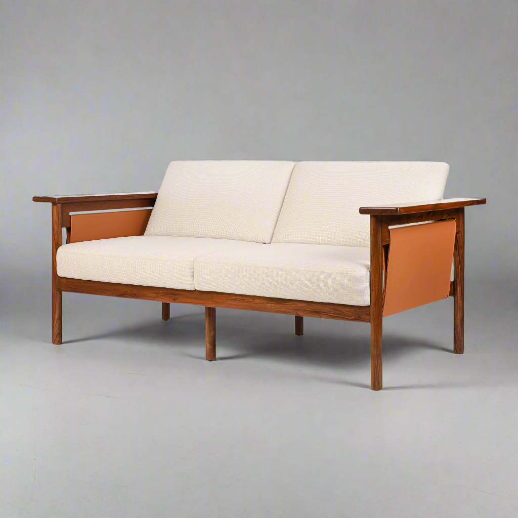Hibiki Japanese minimalist teakwood sofa with upholstered seat and back cushions and signature side leather panel detail – iso view