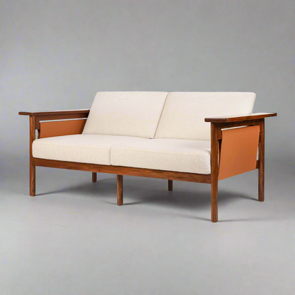 Hibiki Japanese minimalist teakwood sofa with upholstered seat and back cushions and signature side leather panel detail – iso view