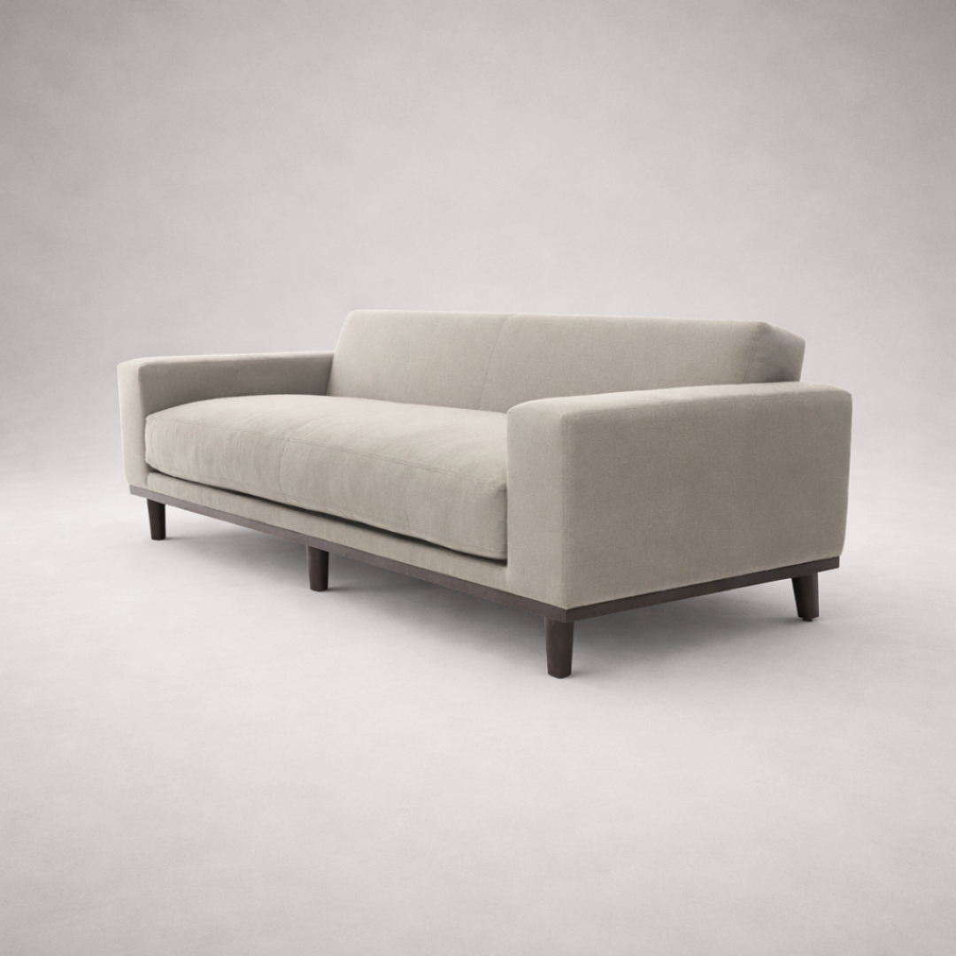 Irene minimal fabric sofa three-quarter iso view showing structured arms and wooden plinth base