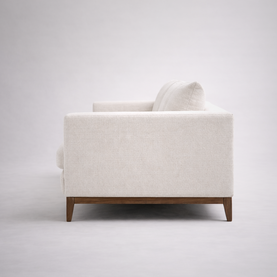 Noma modern minimalist fabric sofa with solid teakwood base and clean linear form for contemporary living rooms side view