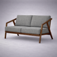 Paula S 2 seater modern teakwood frame sofa with upholstered cushions – iso view