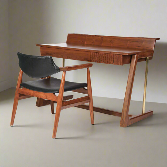 Wooden desk with black chair on a white background