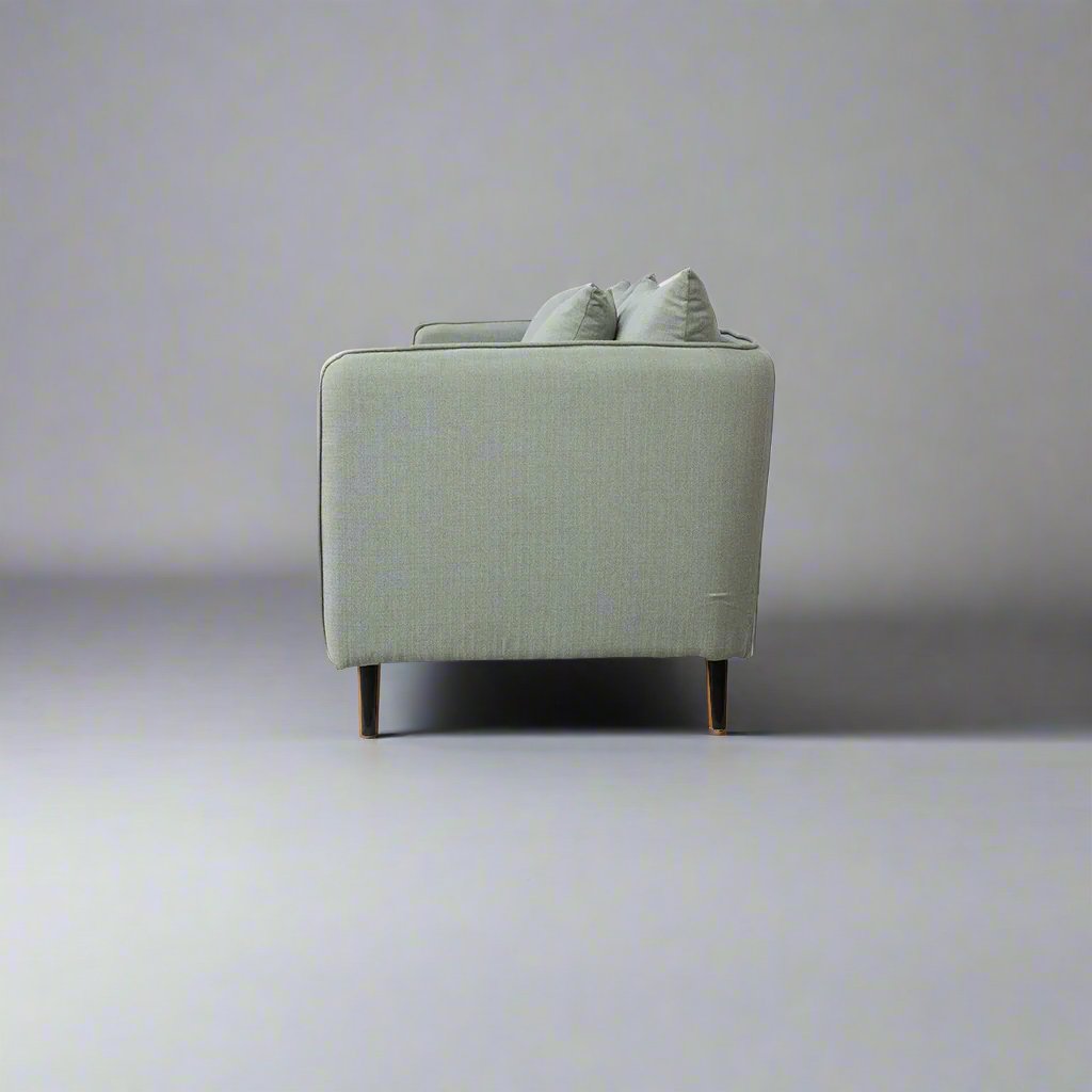 Falcon modern fabric sofa with solid teakwood base and clean contemporary lines – side view